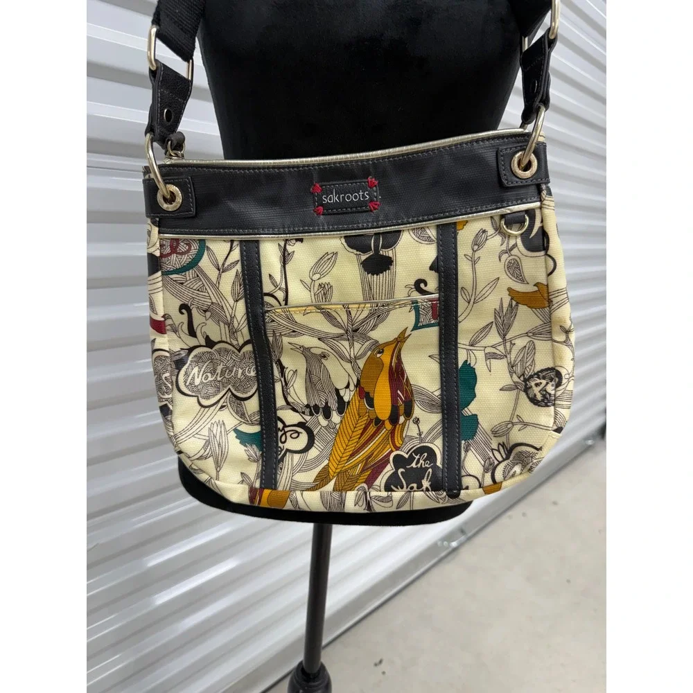 Sakroots Artist Circle Peace Print Bird Crossbody Bag Coated Canvas Cream Black